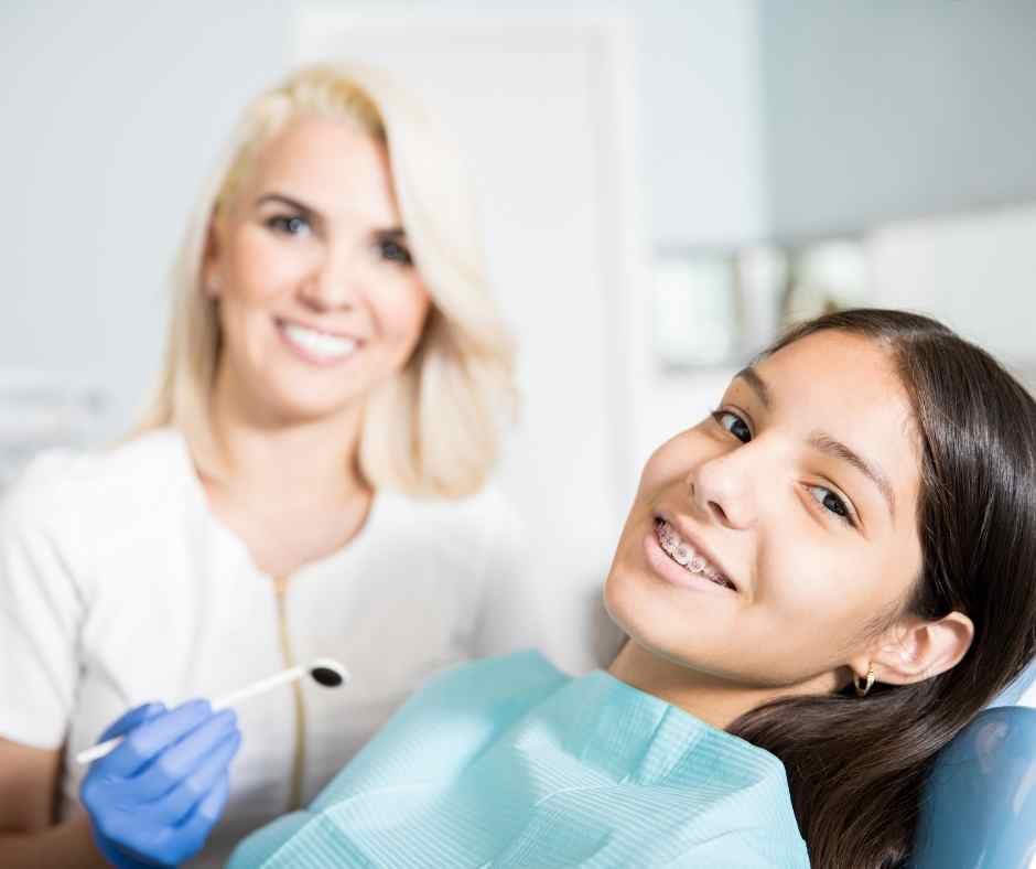 Girl with braces at dental appointment.